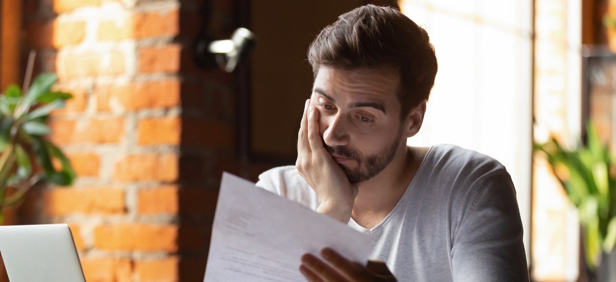 Man with paper photo